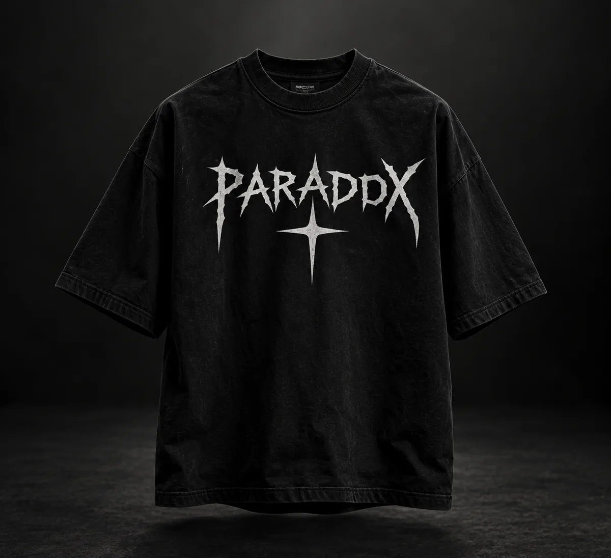 PARADOX design: washed-black oversized tee with spiky silver-white HTV graphic and star